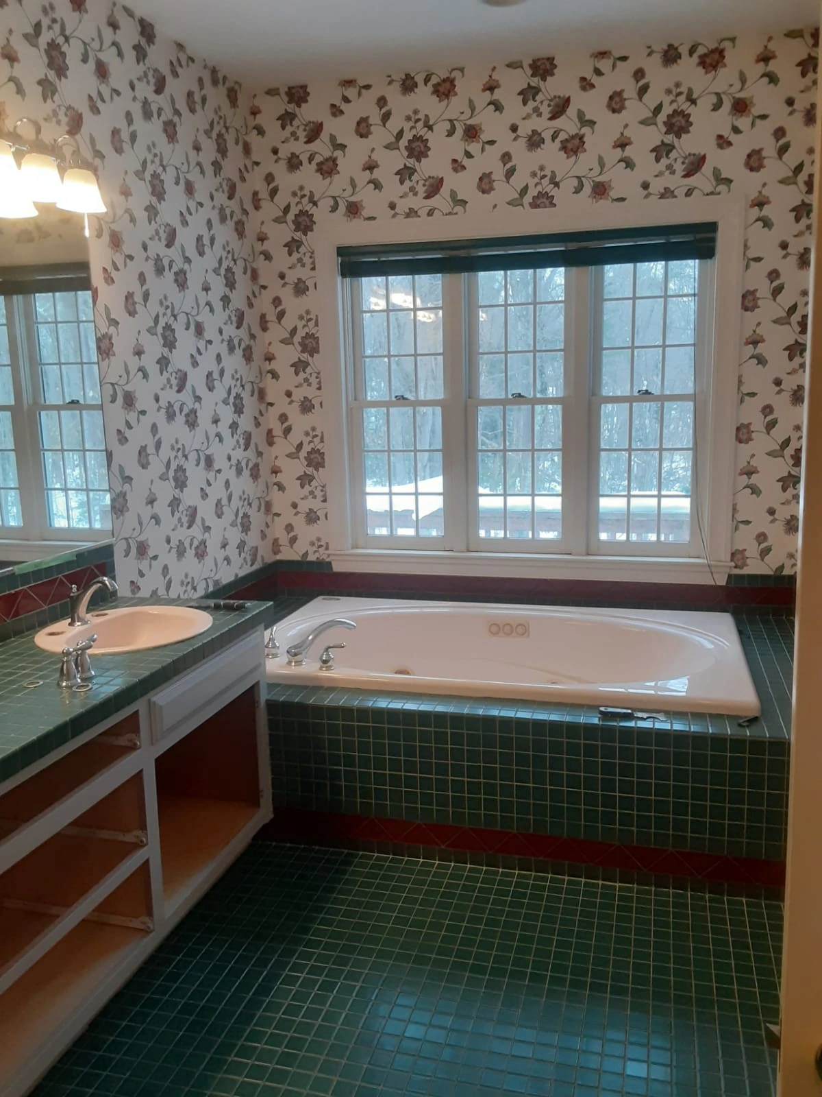 Bathroom before remodel in Sherborn, MA, with green tile whirlpool tub surround and floral wallpaper